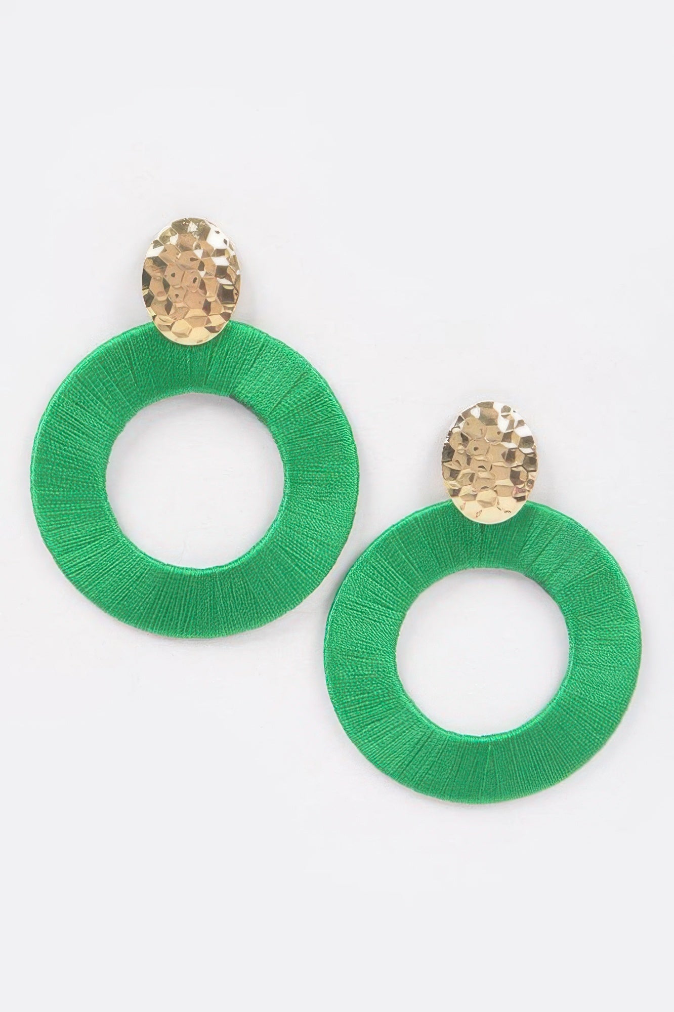Colorful thread hoop earrings, green circular hoops with gold-toned stud tops.