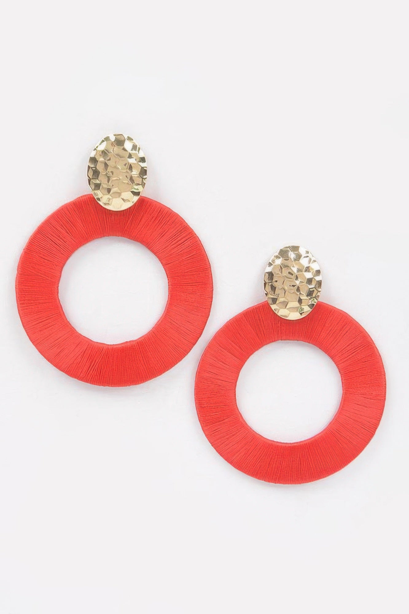 Colorful thread hoop earrings, red circular hoops with gold-toned stud tops.
