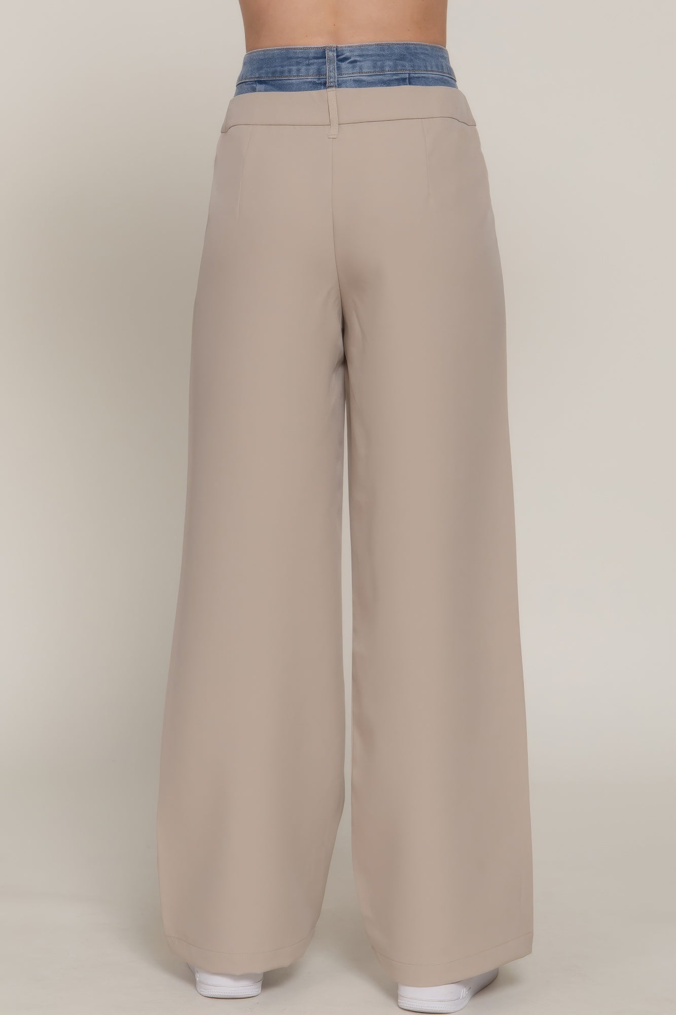 Taupe straight long pants back view with blue contrast denim waistband