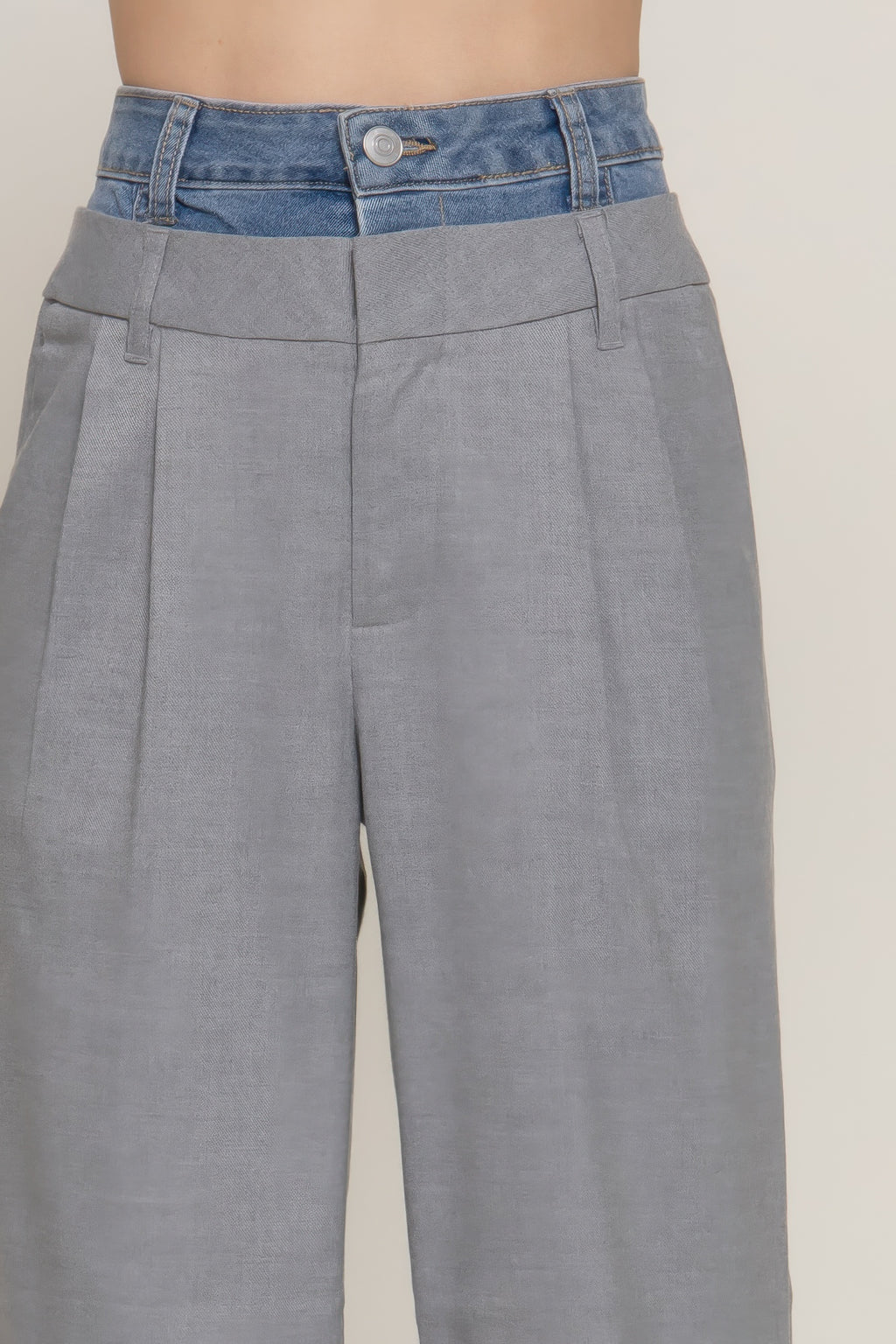 Heather grey denim pants, back view; contrast blue waistband and button closure