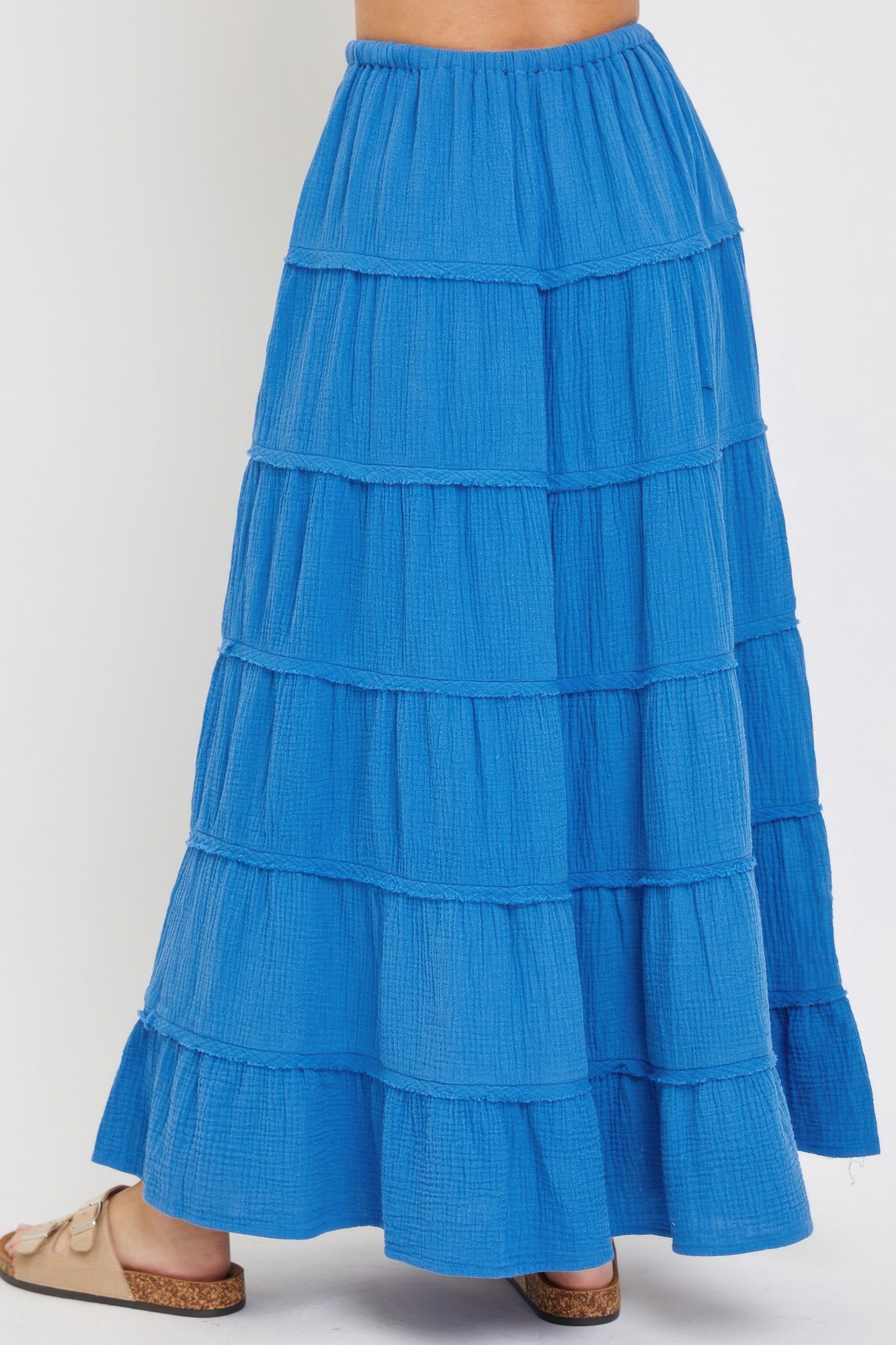 Blue tiered maxi skirt back view, ruched tier panels and elastic waist