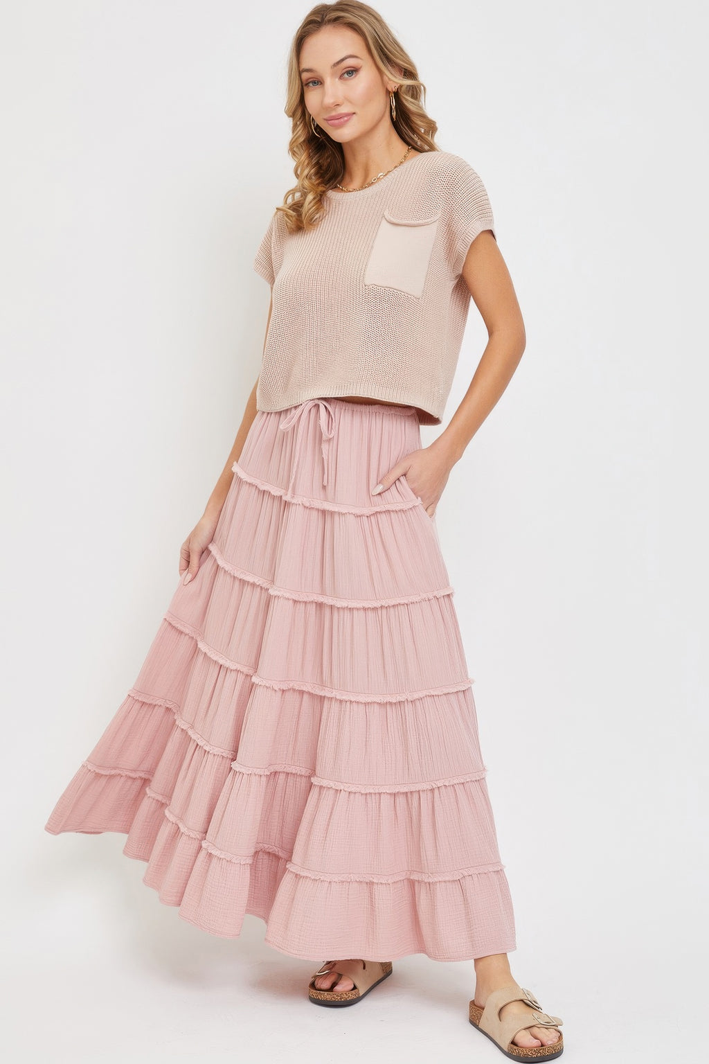 Blush pink tiered maxi skirt in cotton gauze, flared silhouette with ruffle layers
