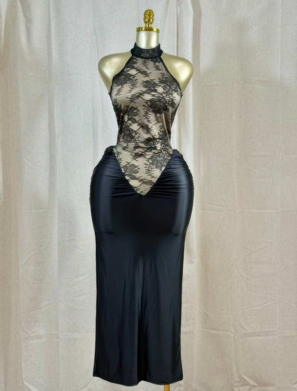 Black lace hourglass dress with high halter neckline and ruched hip detailing, long fit