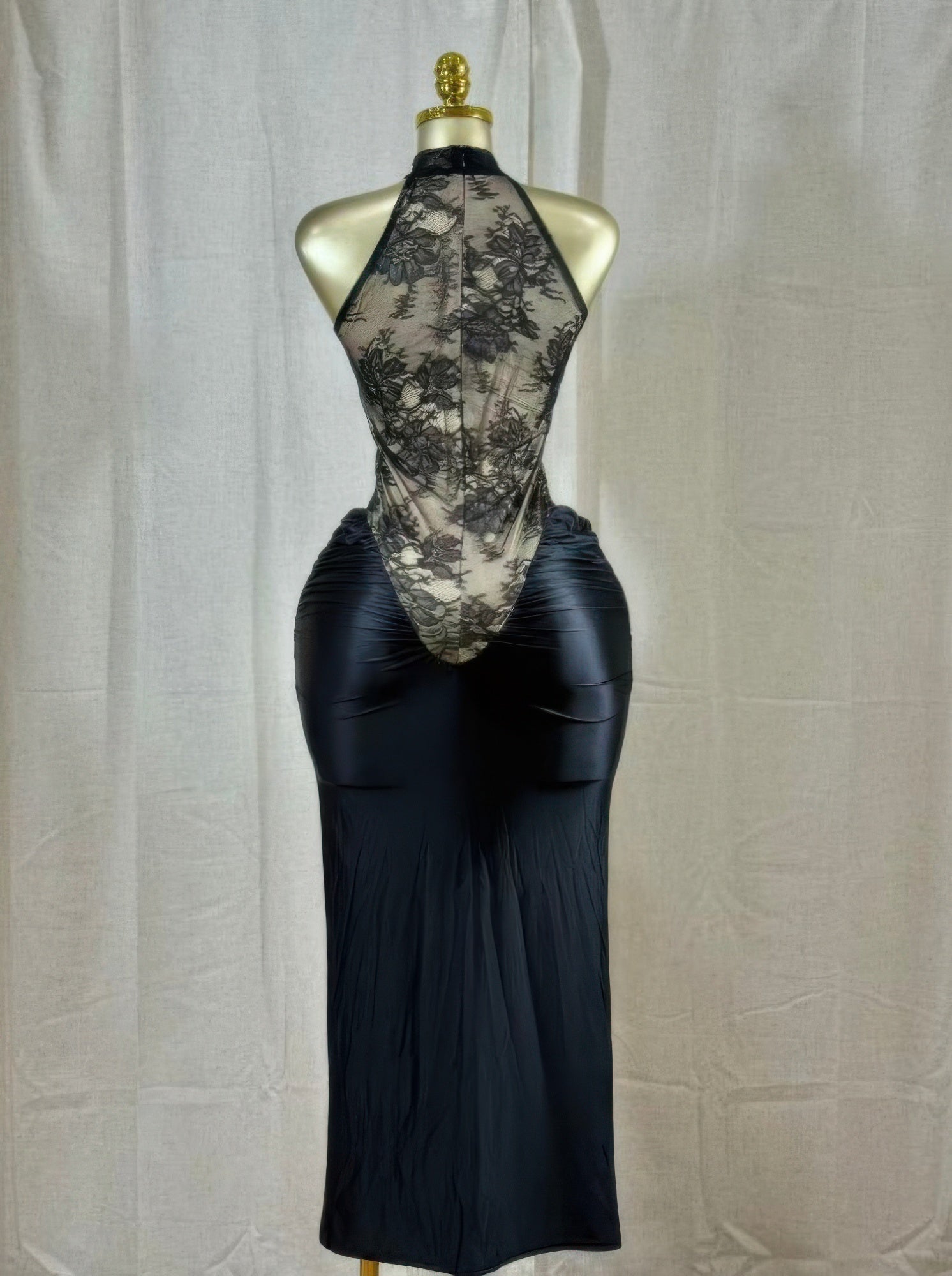 Back view black lace hourglass dress with sheer floral upper and long ruched skirt