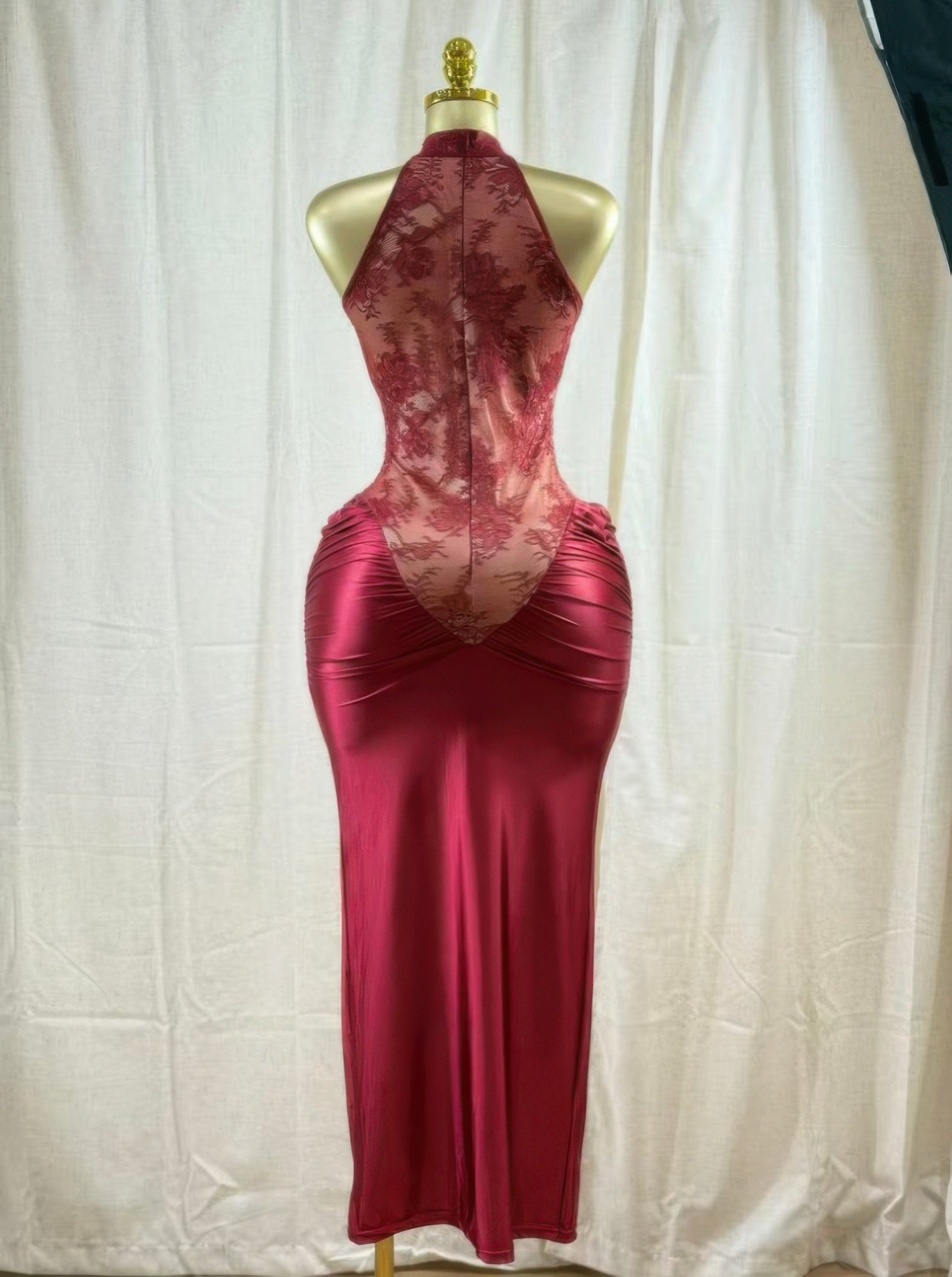 Red hourglass slip dress with lace upper panel, ruched bust, and flowing skirt