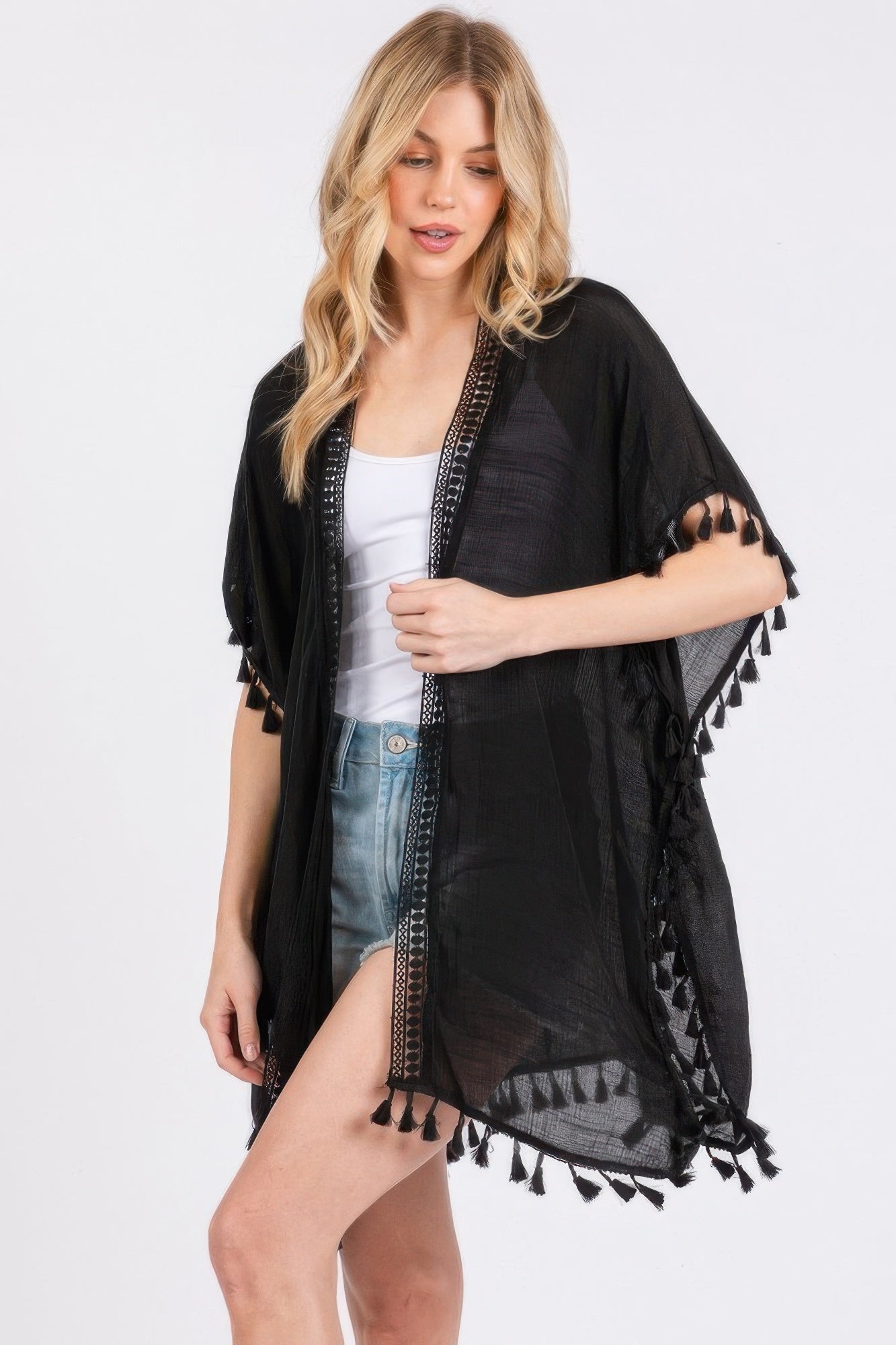 Black sheer cover-up with crochet neckline trim and tassel hem
