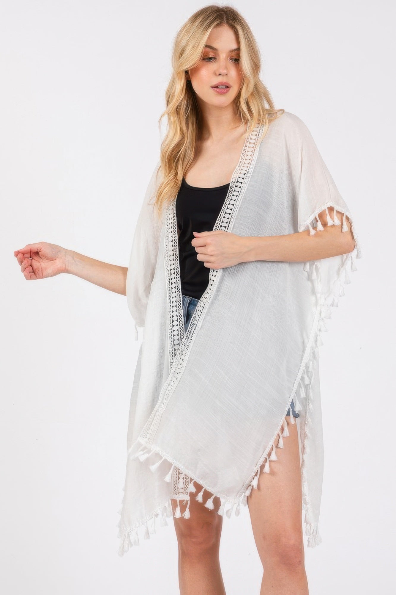 White sheer cover-up with diagonal crochet border and tassel-trim hem