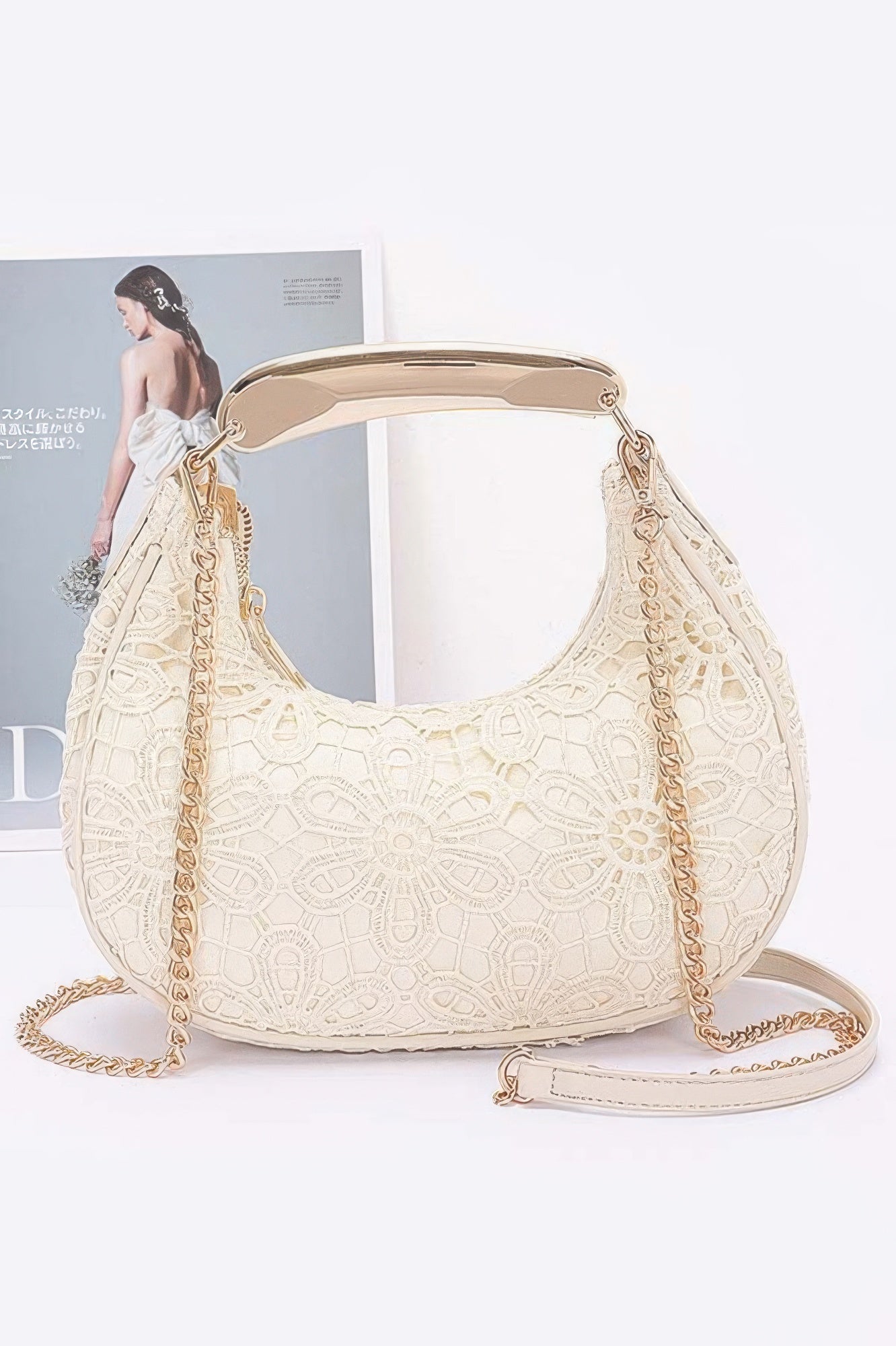 Beige crochet crossbody bag with gold-tone chain strap and faux-leather shoulder strap