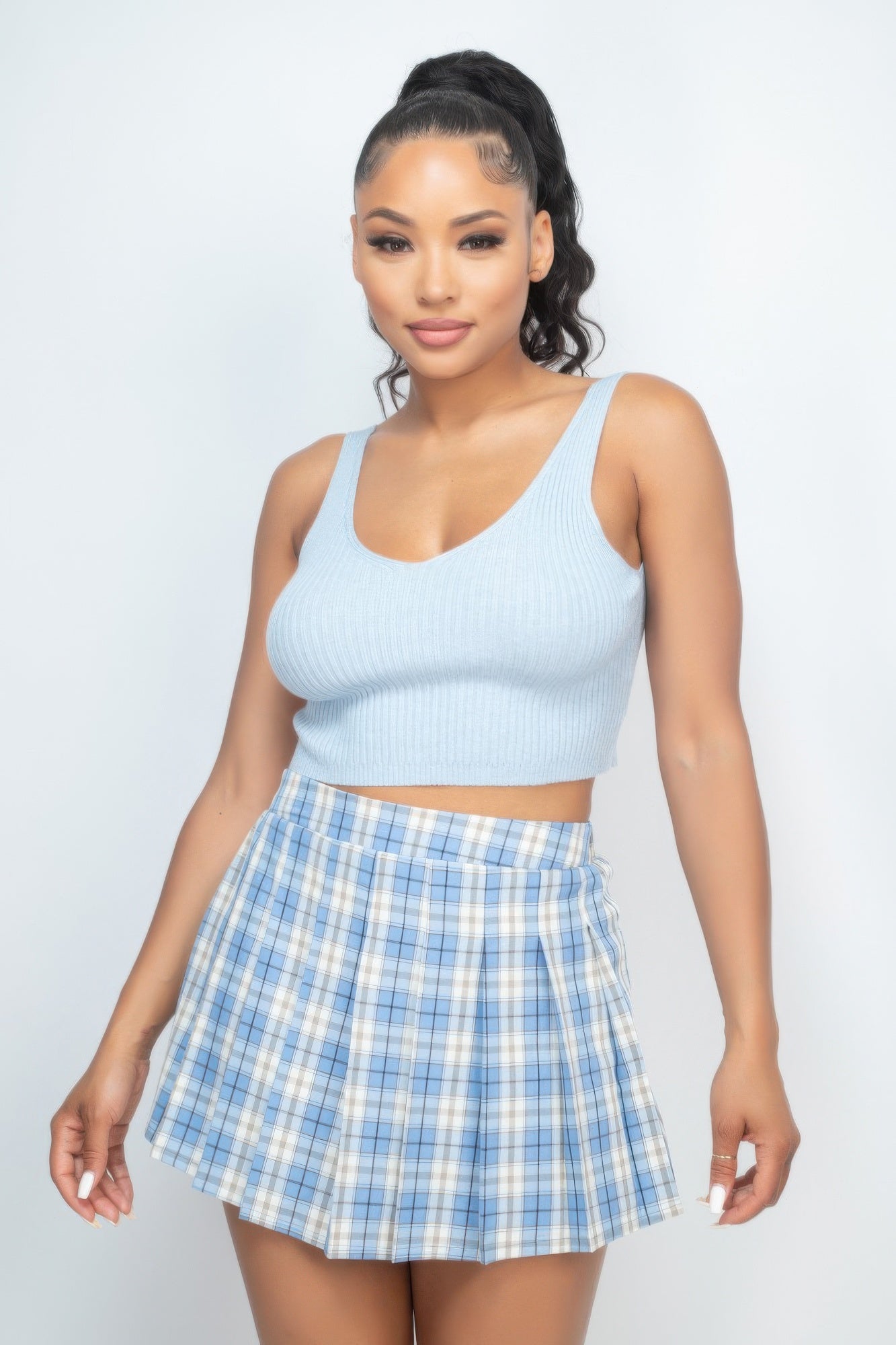 Light blue ribbed crop tank top (V-neck) with plaid mini skirt