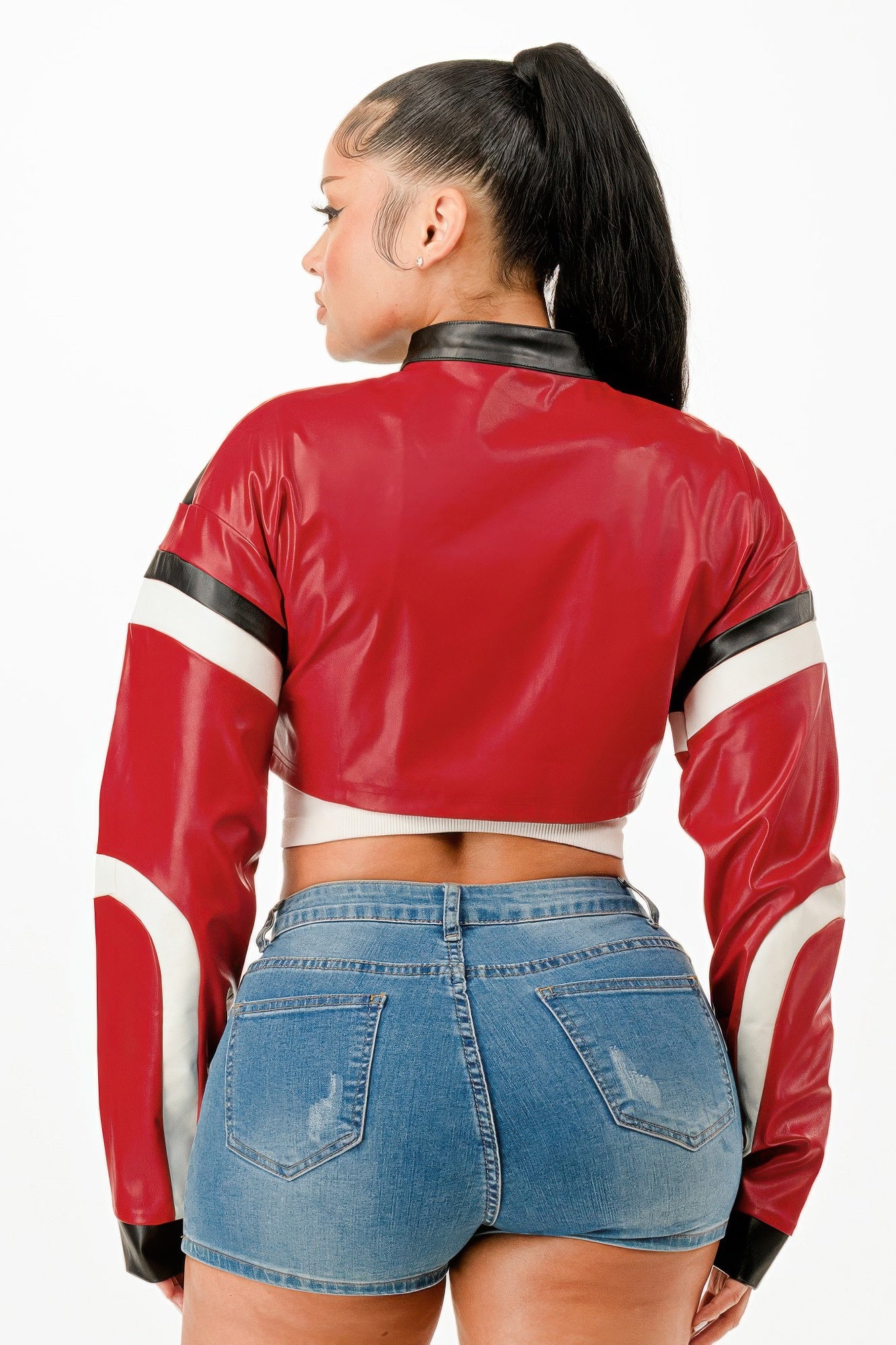 Red cropped moto jacket with black collar and white stripe sleeves, back view