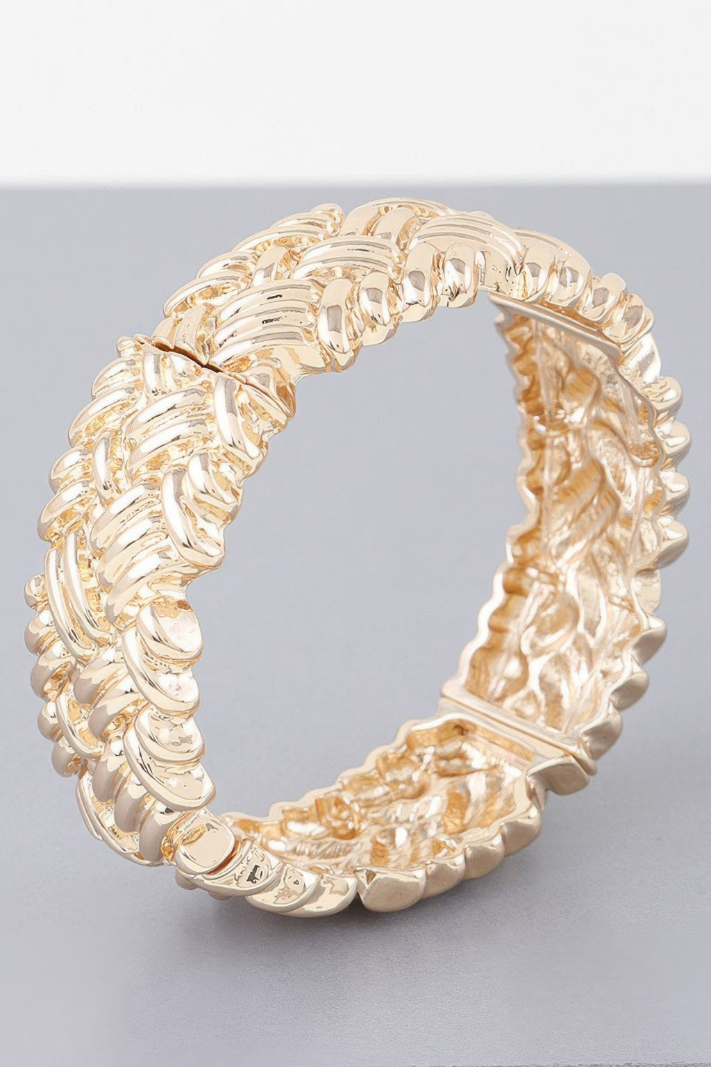 Gold cross hatch cuff bracelet, close view of textured interwoven link pattern.