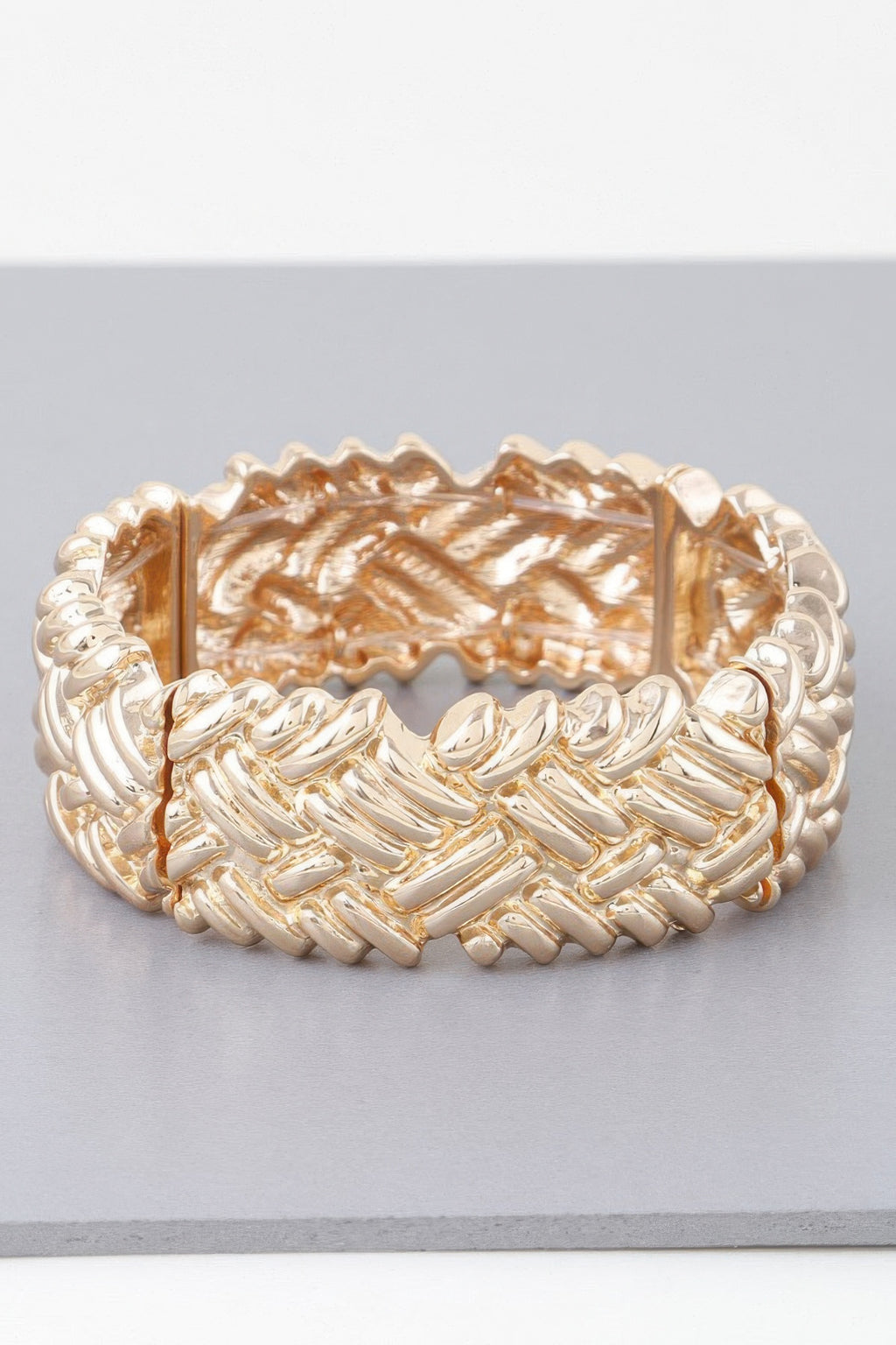 Gold cross hatch cuff bracelet, wide cuff with diagonal raised link ridges.