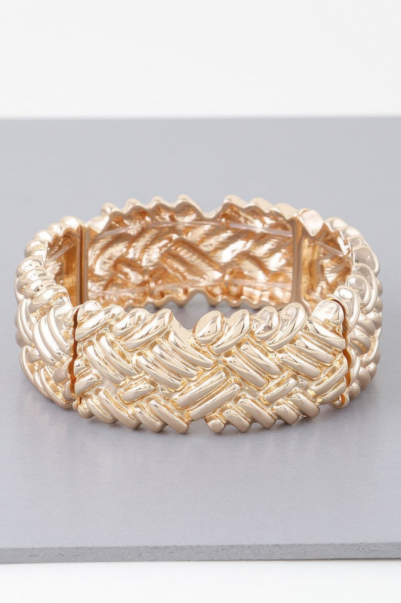 Gold cross hatch cuff bracelet, wide cuff with diagonal raised link ridges.