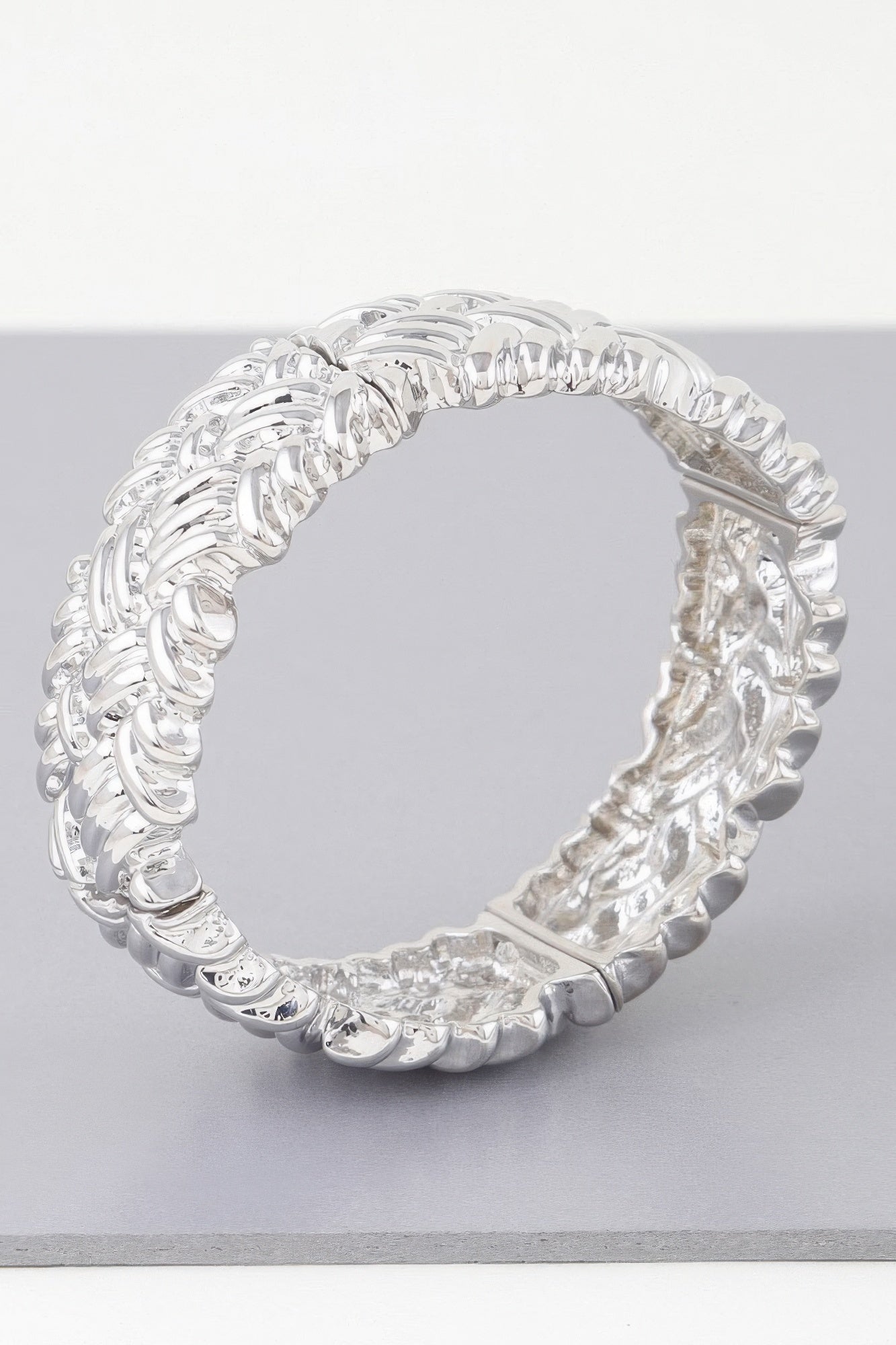 Silver cross hatch cuff bracelet, circular open cuff with glossy interlocking links.