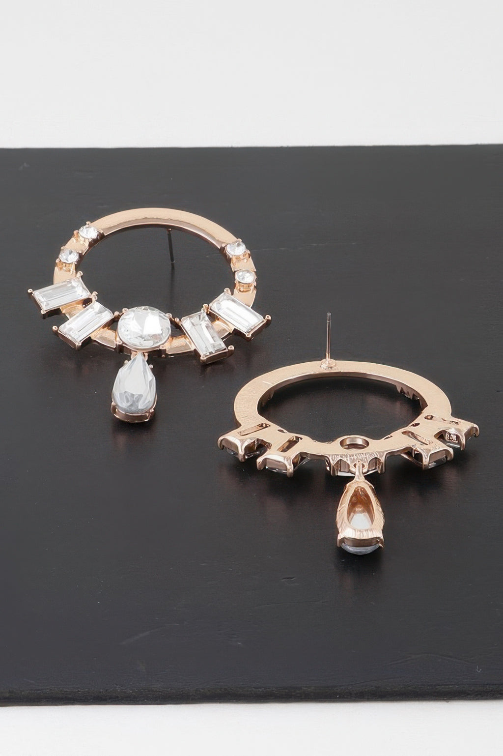 Rose-gold crystal rim drop earrings with clear baguette stones and teardrop charm