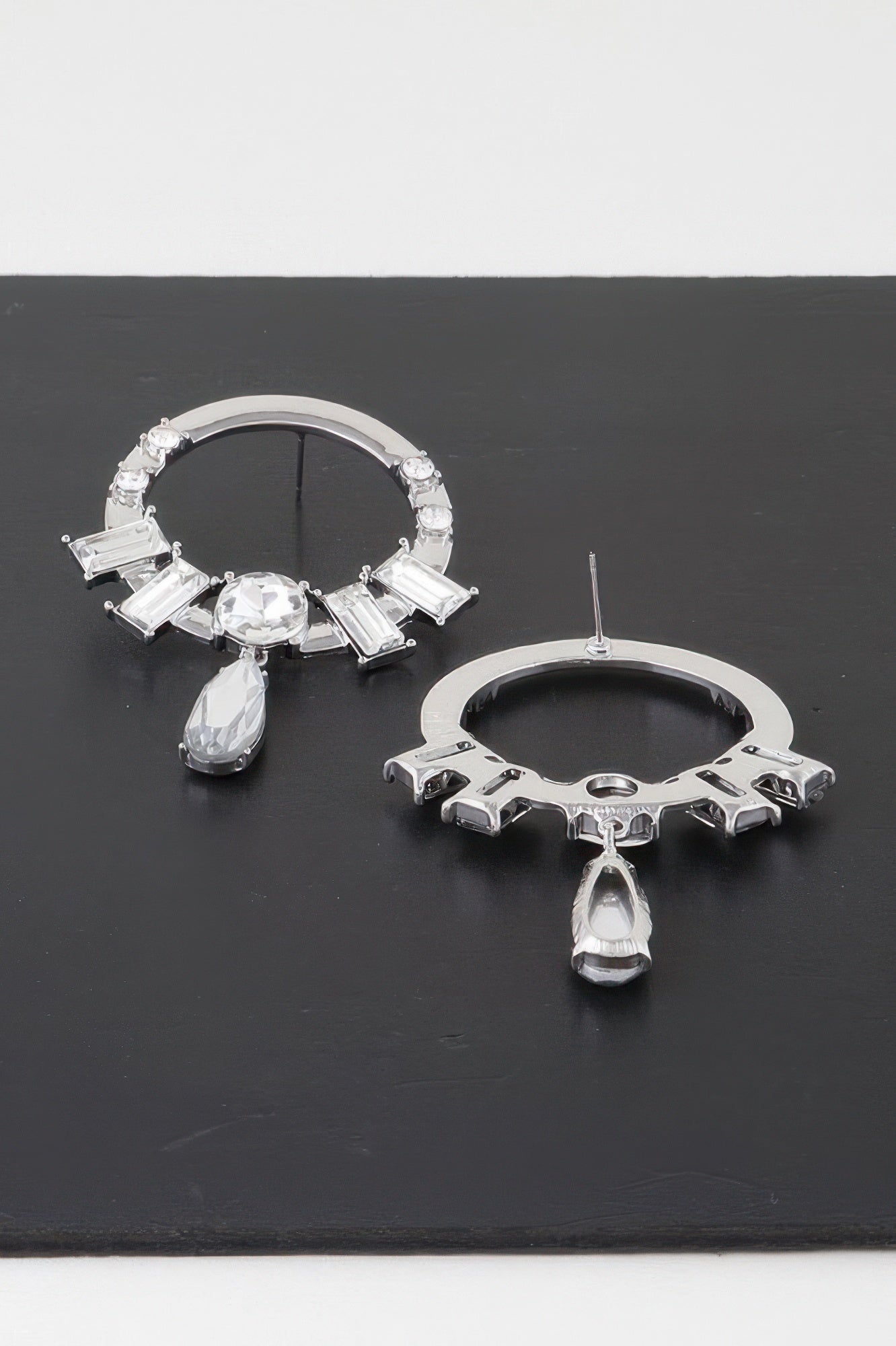 Silver-tone crystal rim drop earrings with clear baguette stones and teardrop dangle