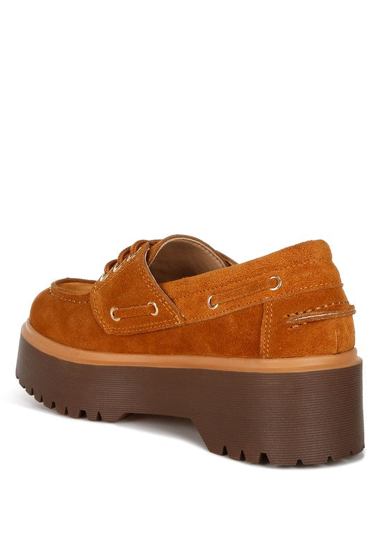 Tan suede loafer with padded collar, lace-up eyelets, and chunky platform sole