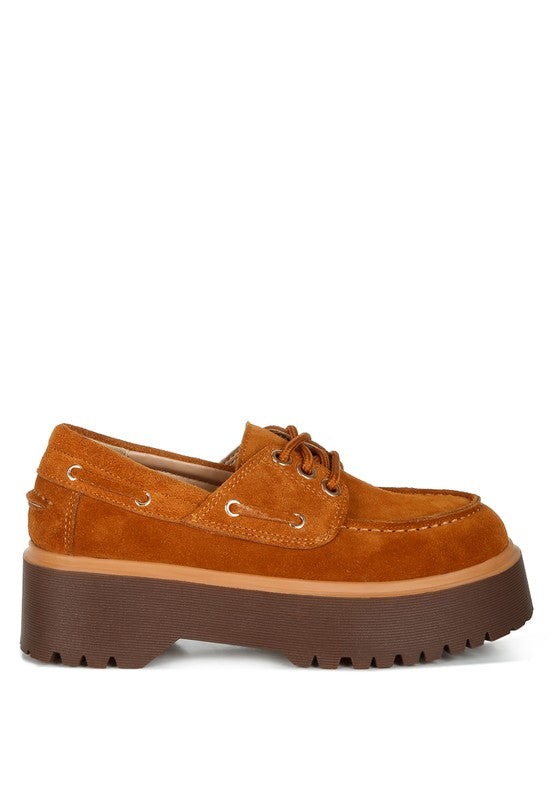 Tan suede oxford loafer with lace-up closure and thick treaded platform sole