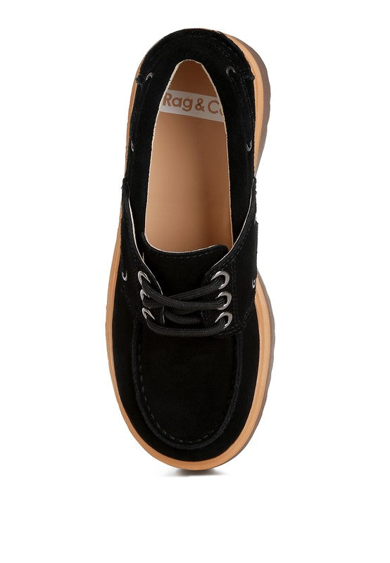 Black suede lace-up oxford loafer showing tan inner lining and stitched eyelets