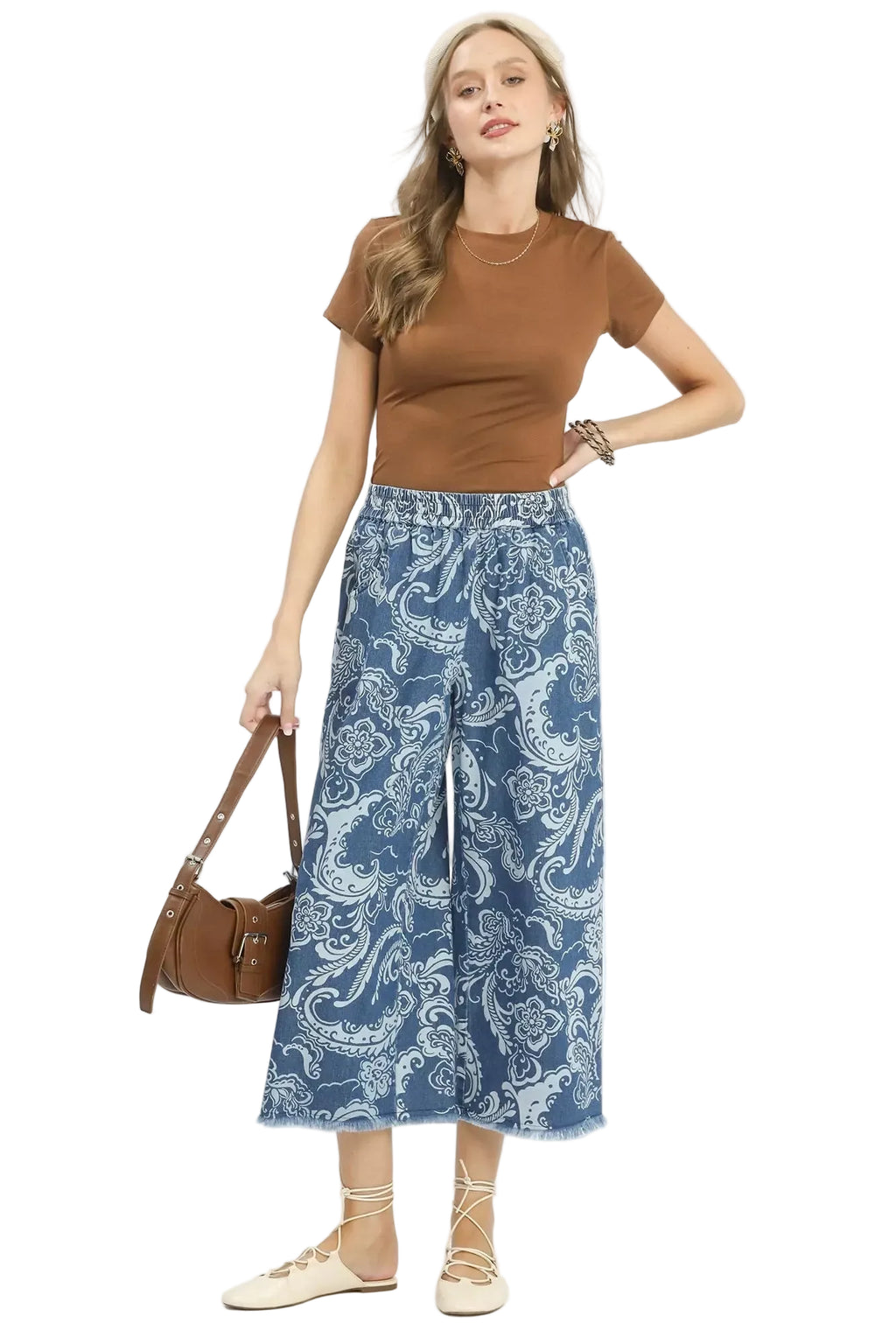 Blue stone-wash wide-leg crop pants with paisley print, elastic waist, frayed hems