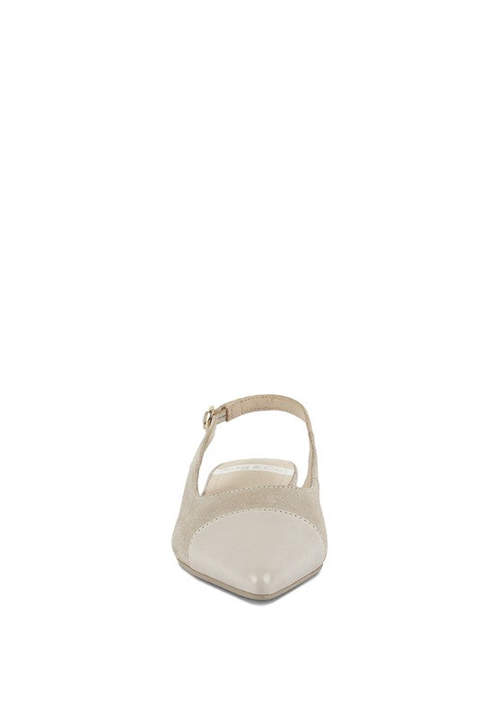 Back view of light beige slingback flats with small metal buckle and covered heel