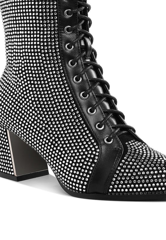 Black rhinestone ankle boots close-up of lace-up and side panel