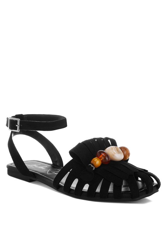 Black cutwork flat ankle-strap sandals with front bead and fringe embellishment