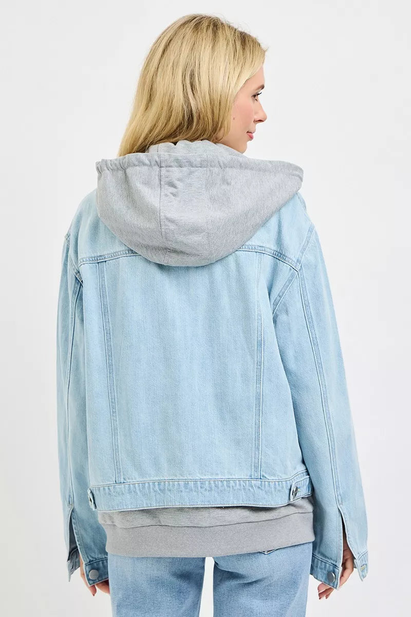 Back view of RISEN oversized hoodie jacket in light denim with hood and pockets