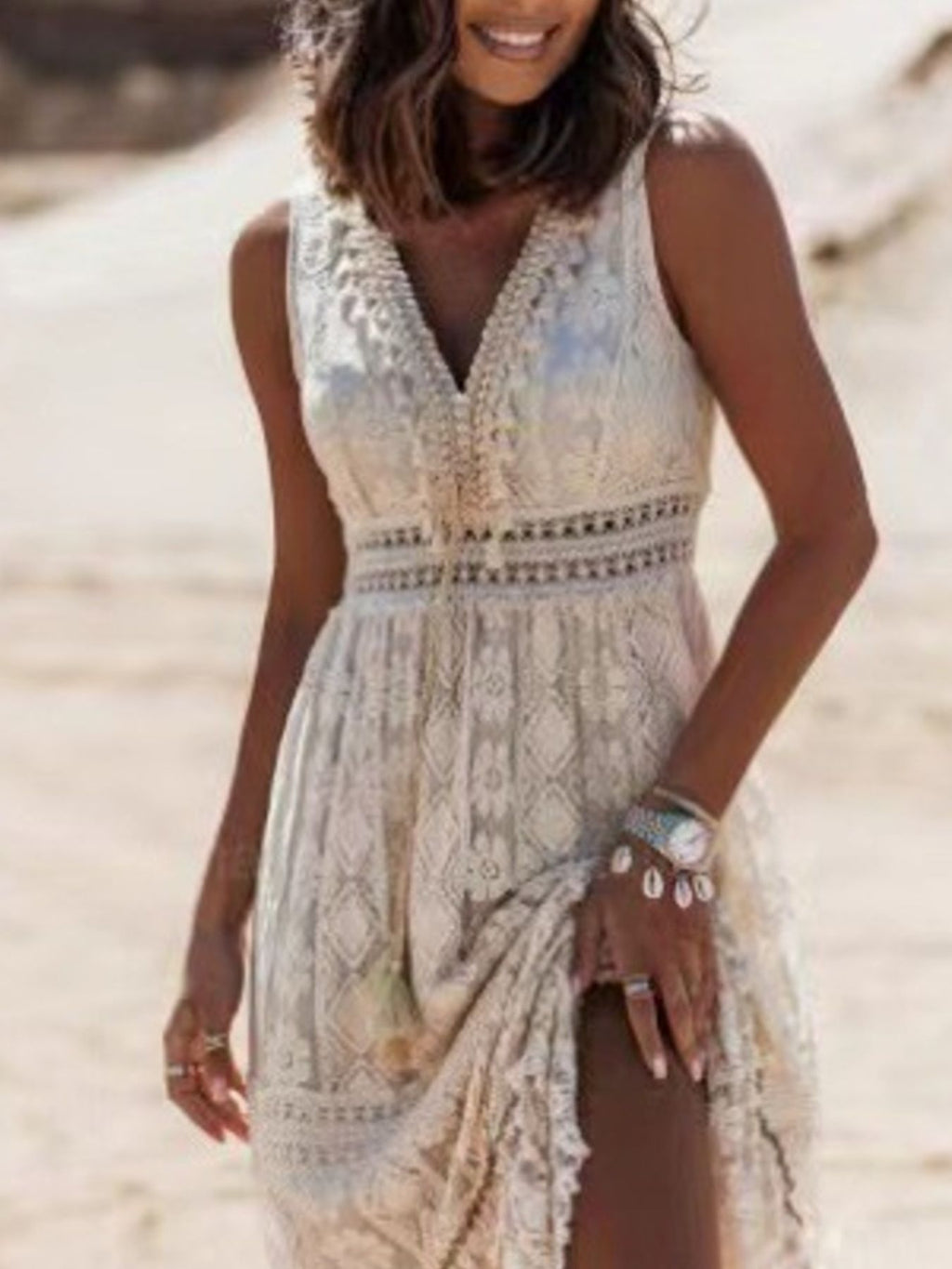 Apricot lace maxi dress with deep V-neck, fitted waist and flowing tiered hem