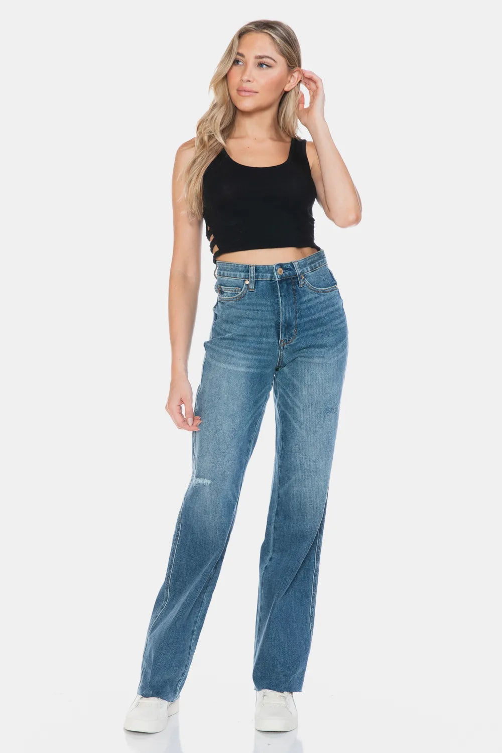 Medium wash straight jeans with raw hem, tummy control panel and front button closure