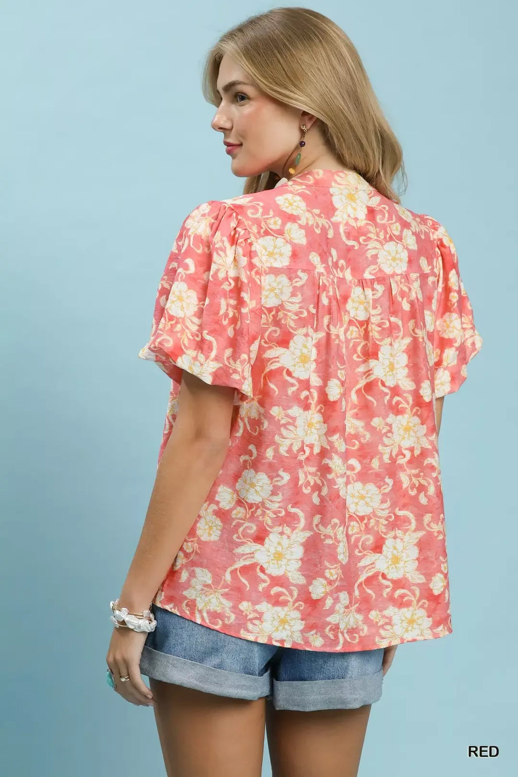 Red floral shirt with V-neck and short flutter sleeves, back view