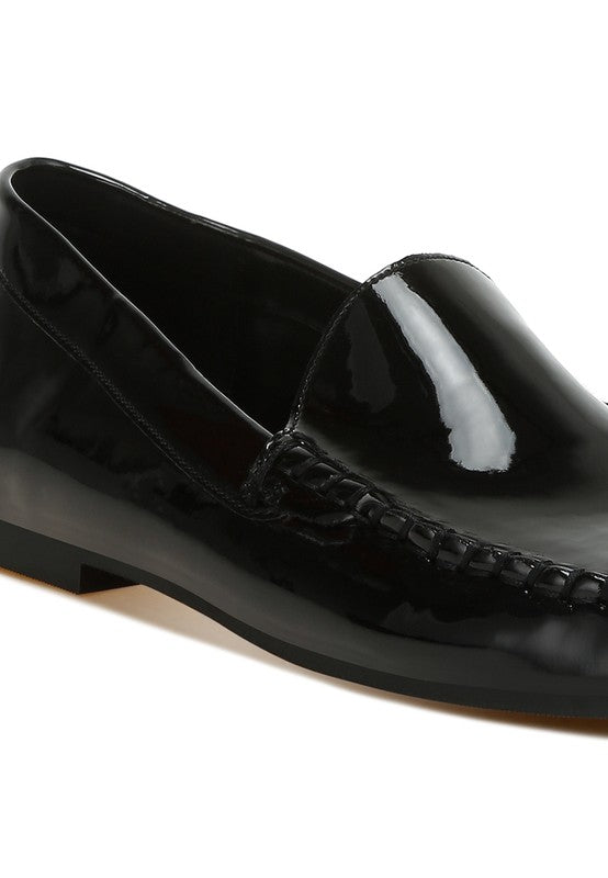 Black patent pleather loafer front close-up, stitched vamp detail