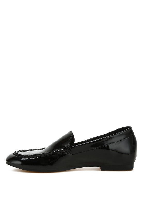 Black patent pleather loafer side profile, classic penny-style vamp