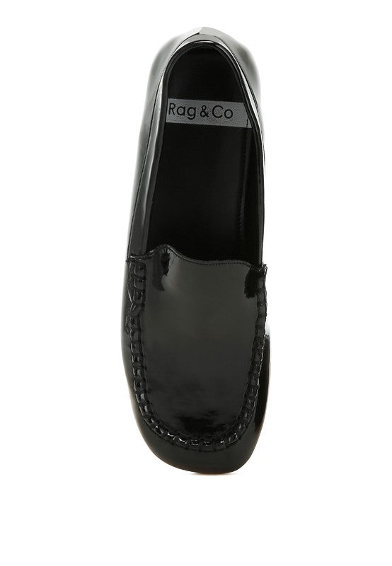 Black patent pleather loafer top view, smooth upper with stitched trim