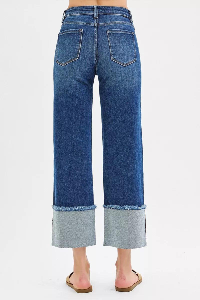 Dark blue mid-rise wide-leg crop jeans with back patch pockets and cuffed hems
