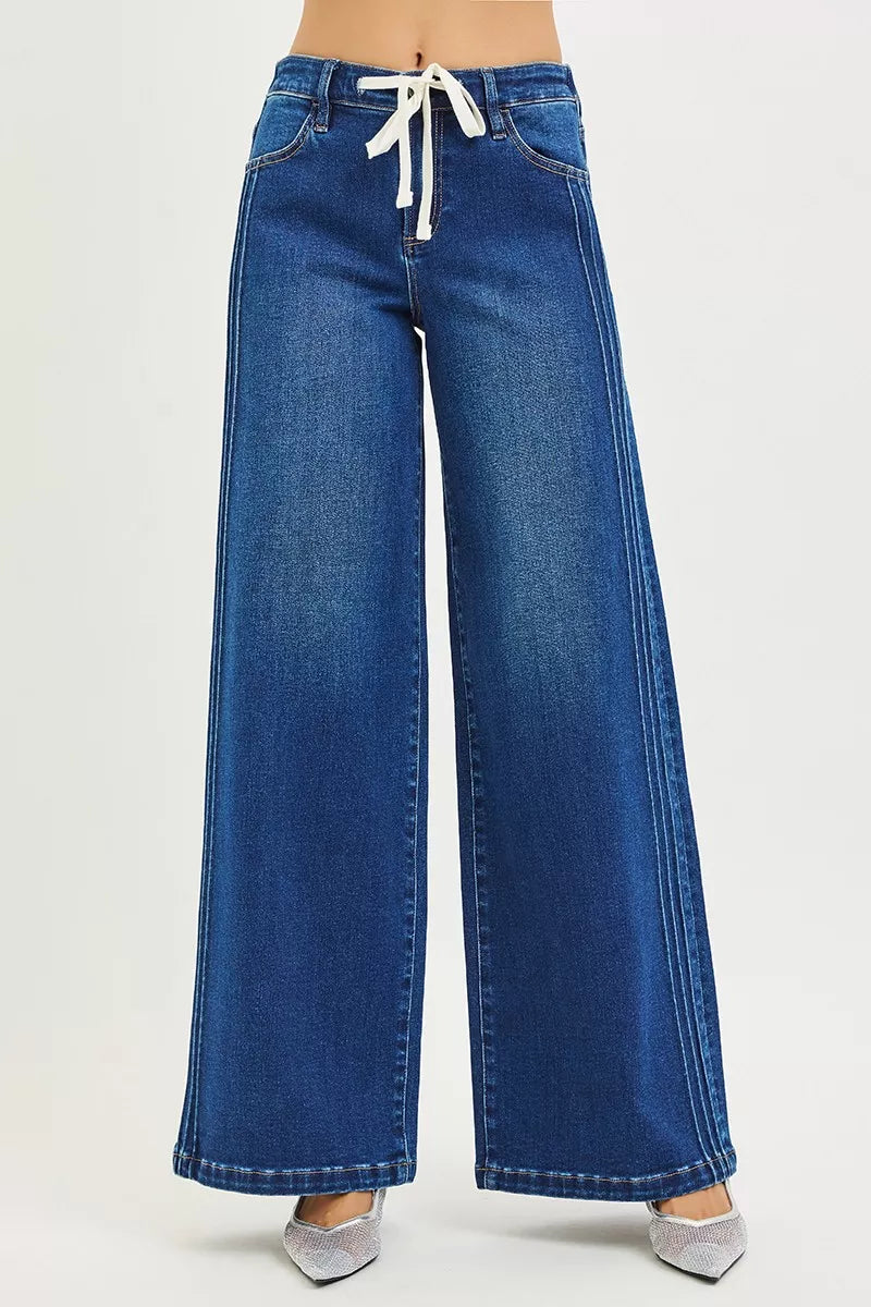 Blue mid-rise wide-leg jeans with white front drawstring at waist