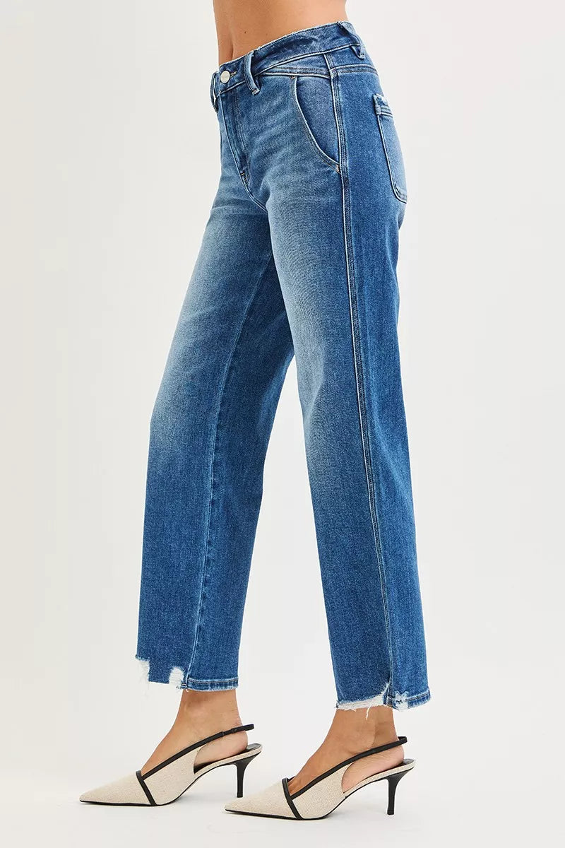 High-rise straight blue jeans with button fly, belt loops, and frayed hem