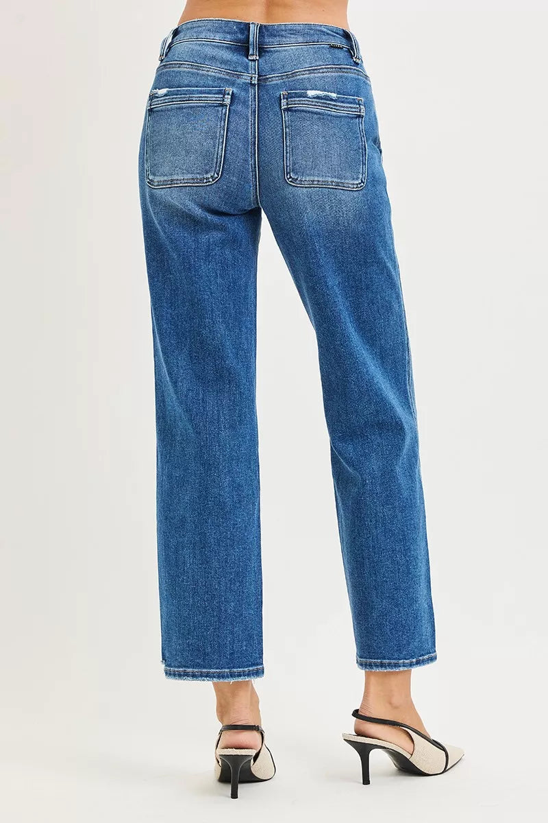 Back view of high-rise straight blue jeans with two rear pockets and frayed hem