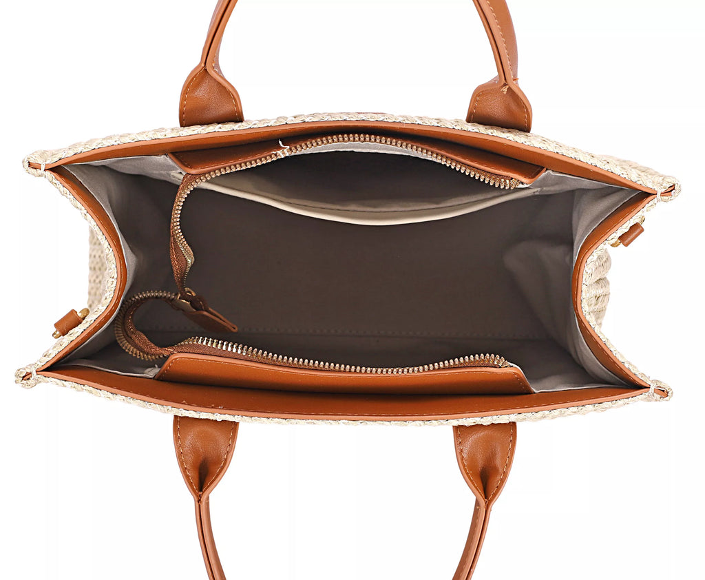 Open woven tote shows lined interior, top zipper, and brown leather trim