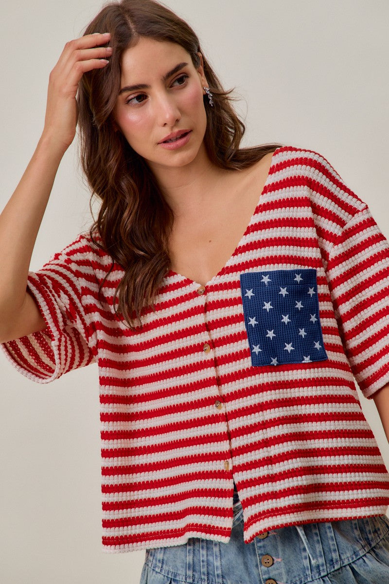 Red-and-ivory striped cardigan with V-neck, button front, and blue star pocket