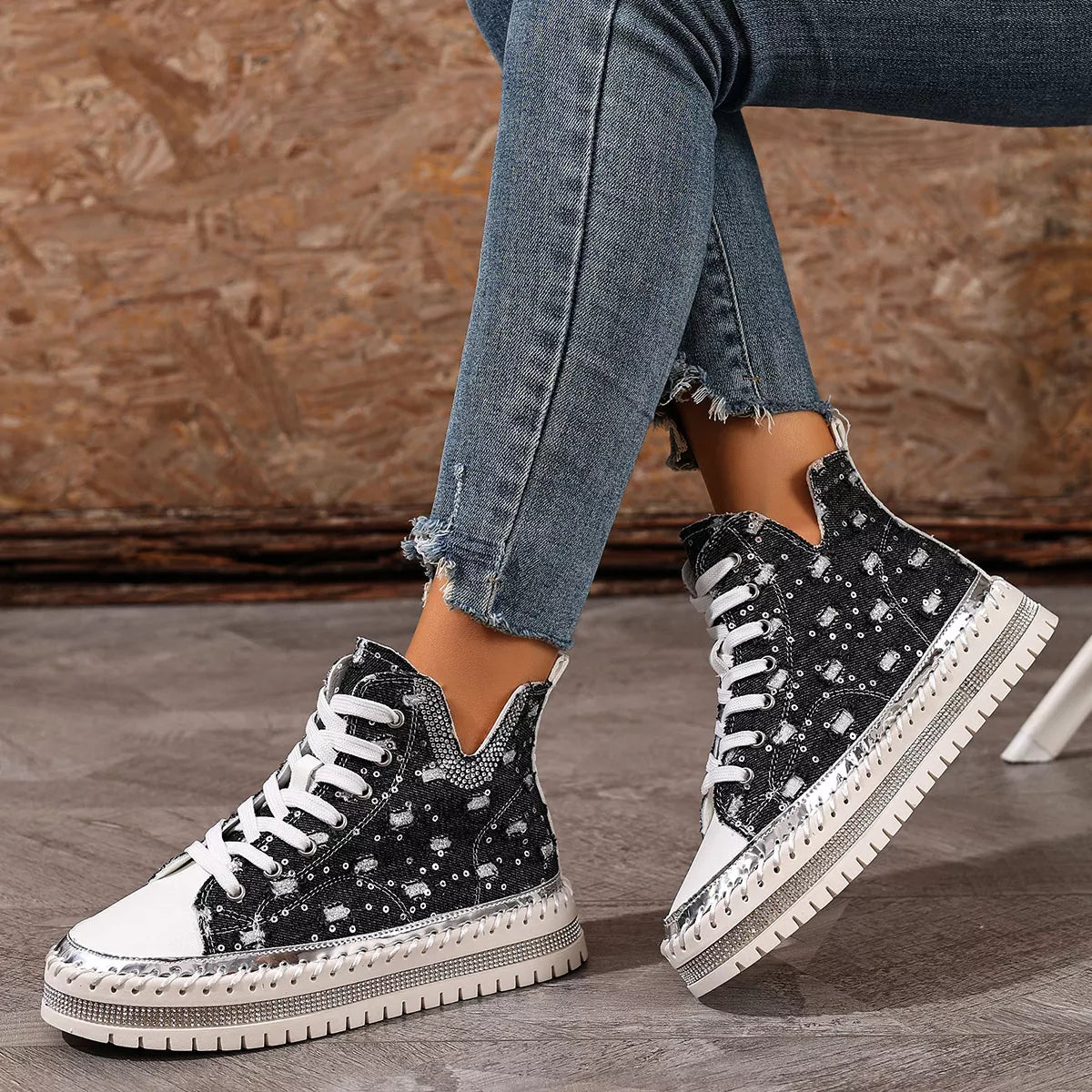 Black lace-up platform sneakers, front angled view with thick tread sole