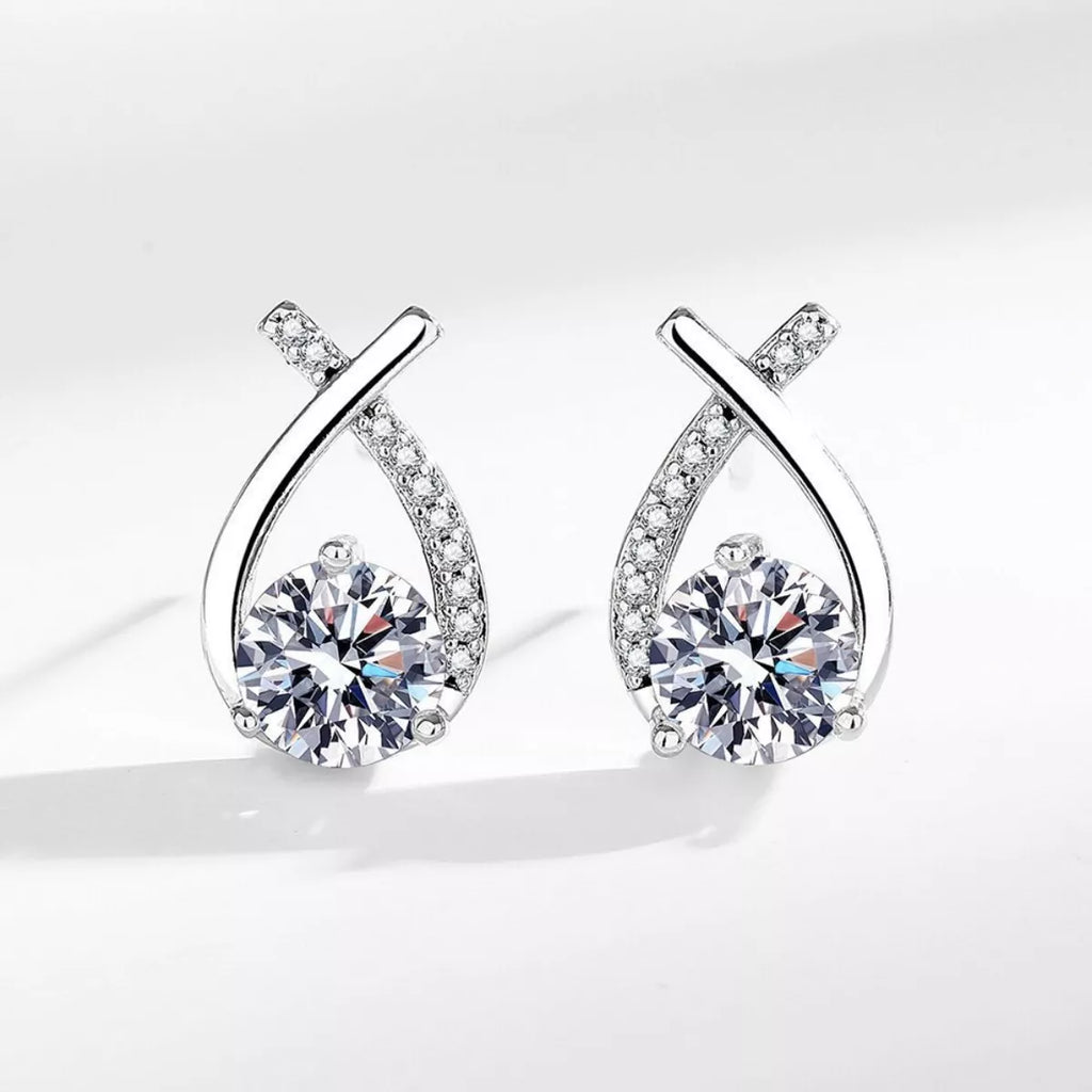 Sterling silver moissanite teardrop earrings with pavé accents and round center stone