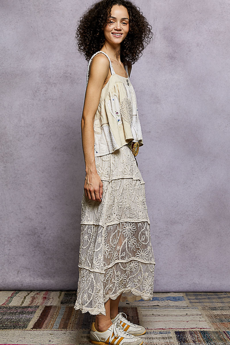 Natural tiered crochet skirt with floral eyelet embroidery and ruffled layers