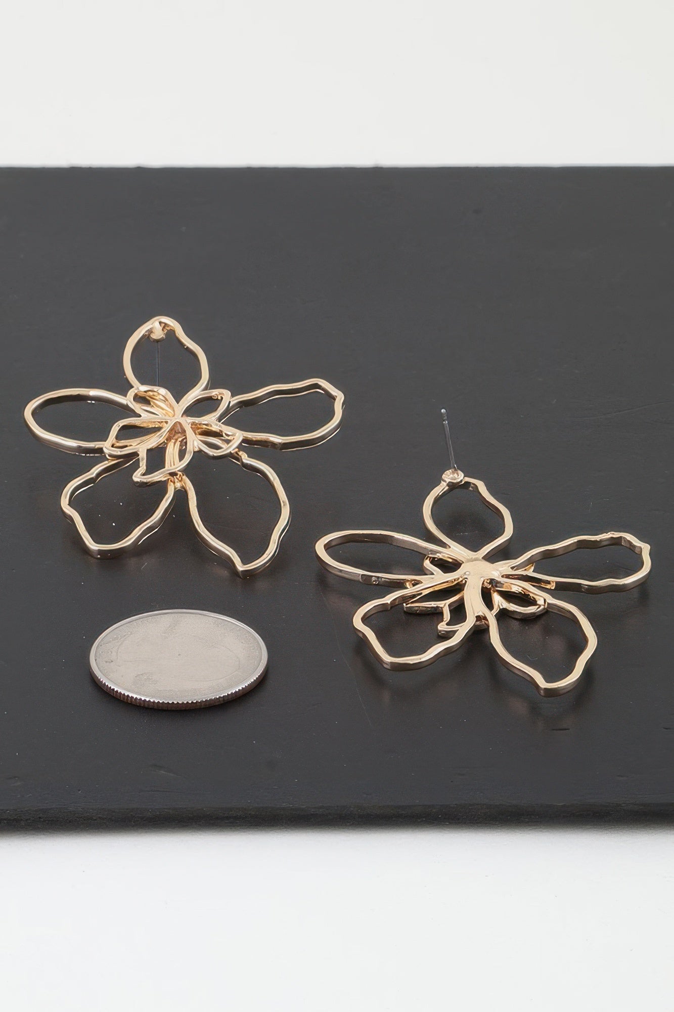 Gold-tone abstract flower drop earrings, dangling five-petal design