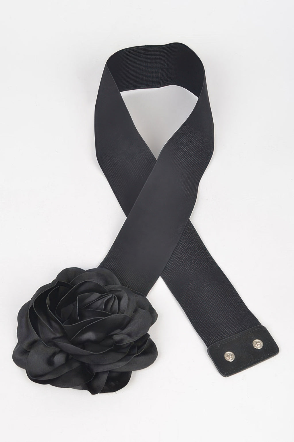 Black elastic belt with bow ends, metal snaps, and large flower accent