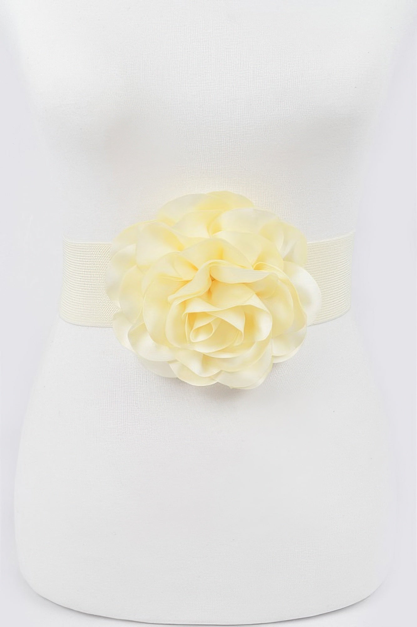 Ivory elastic plus size belt with large layered flower at center
