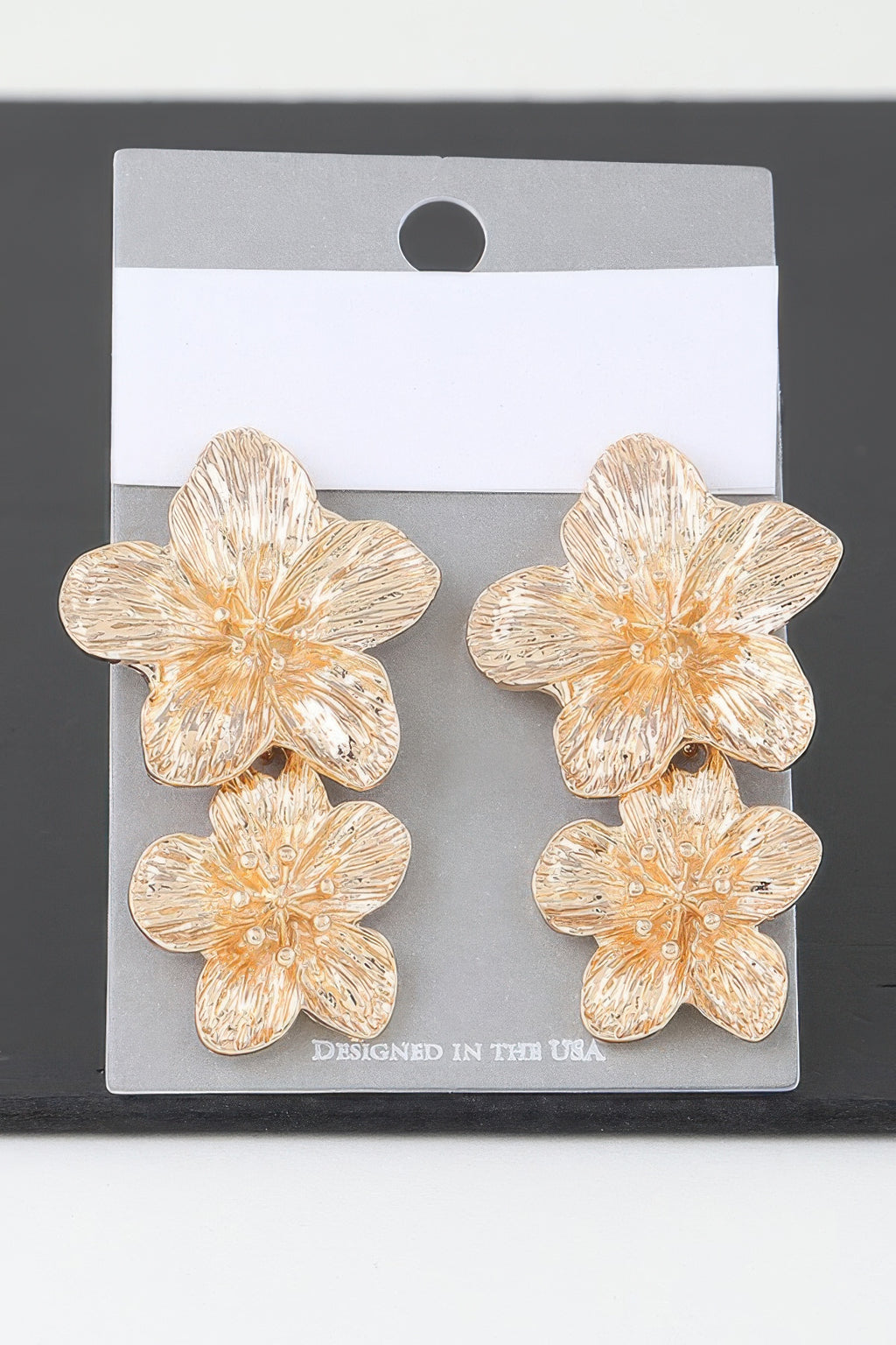 Gold flower stud earrings, textured blooming petals with small center