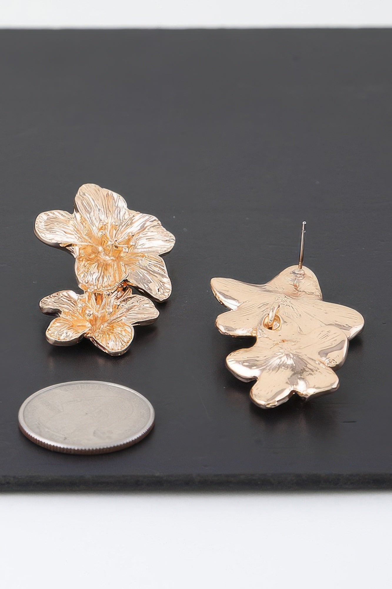 Gold layered flower stud earrings, textured petals, visible metal post