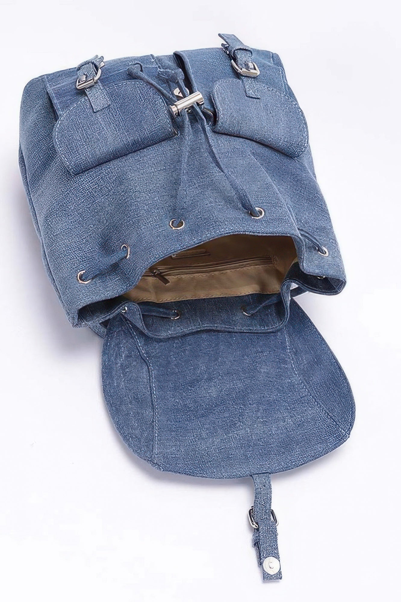 Denim double-pocket backpack open top, front flap buckles, interior visible, shoulder straps