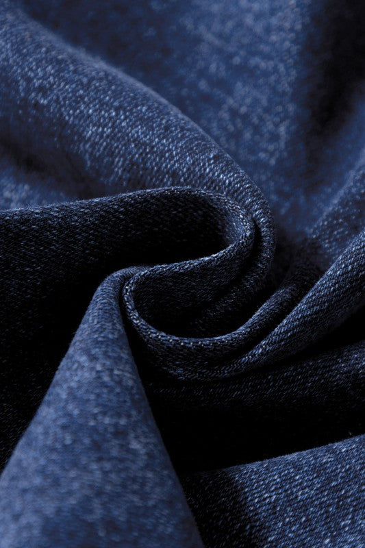 Close-up of dark blue denim fabric texture